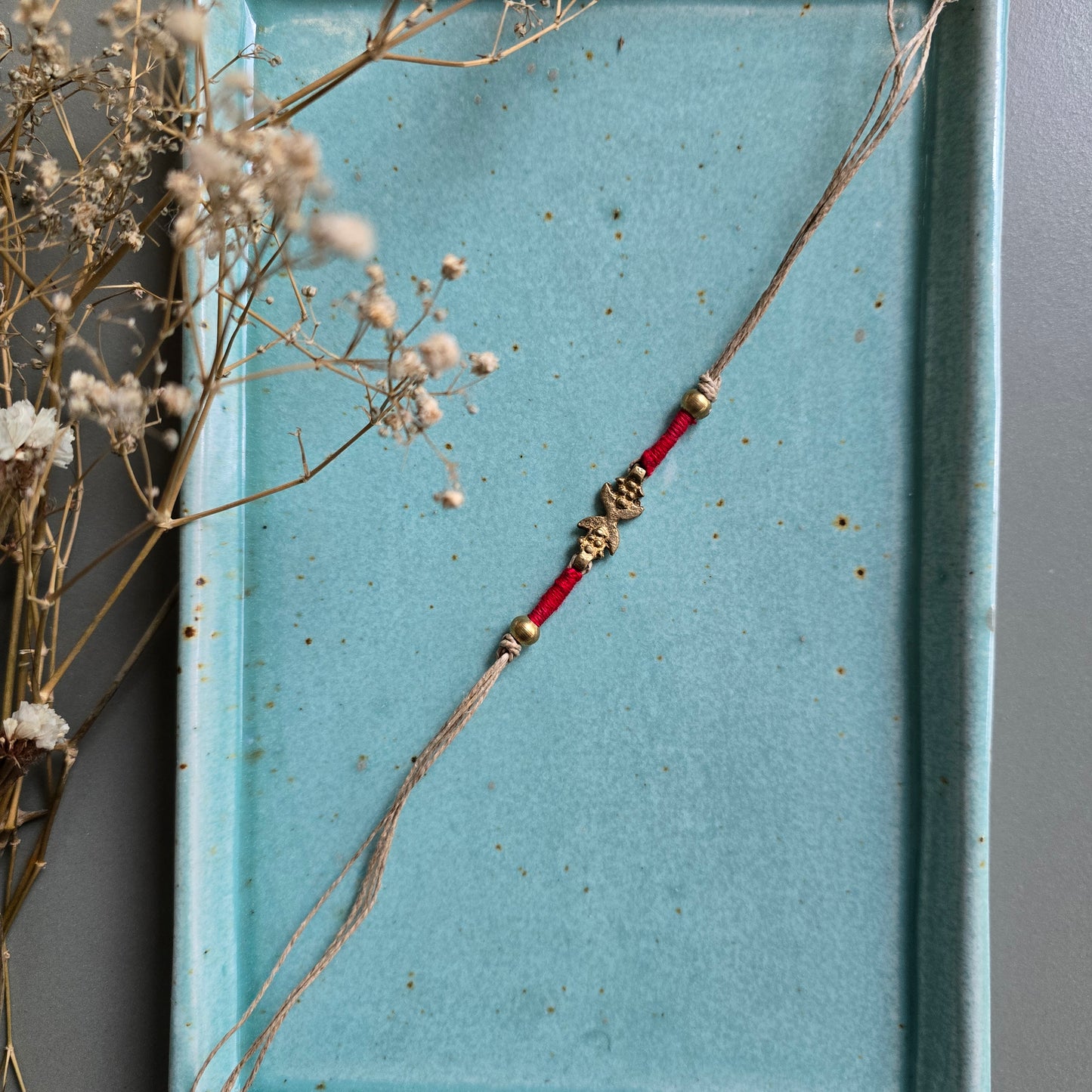 Brass Motifs Rakhis