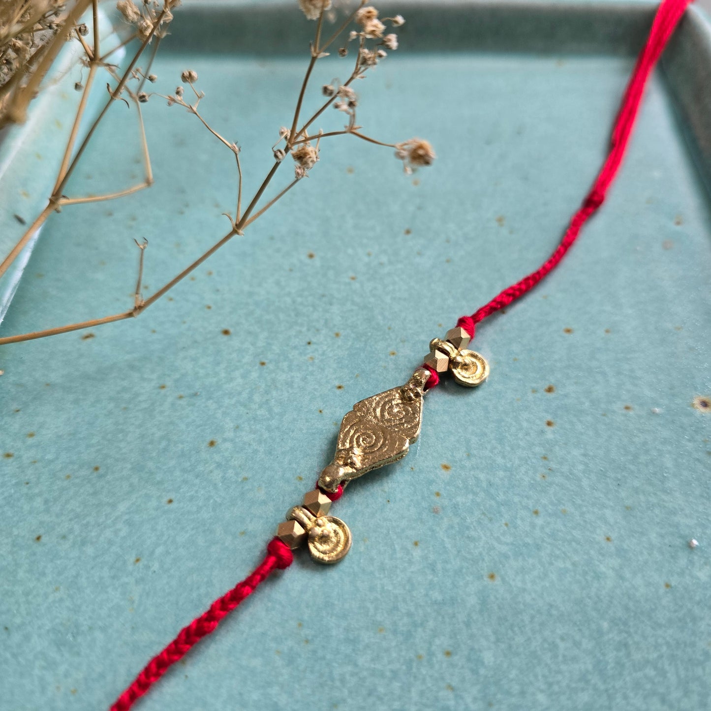 Brass Charms Rakhi