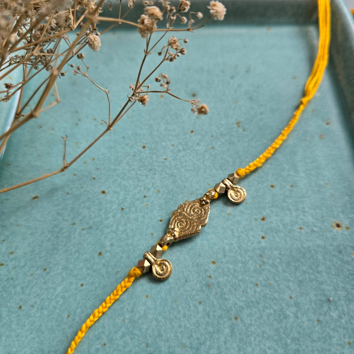 Brass Charms Rakhi - Set Of 3
