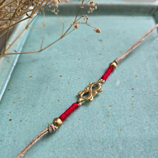 Infinity brass motif rakhi