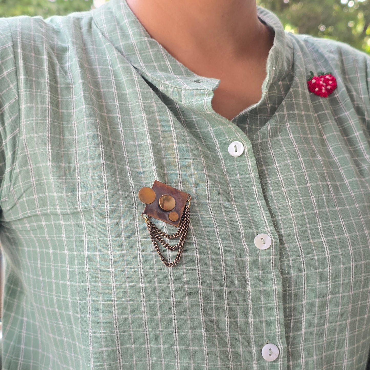 Square brooch with chain and disc embellishments