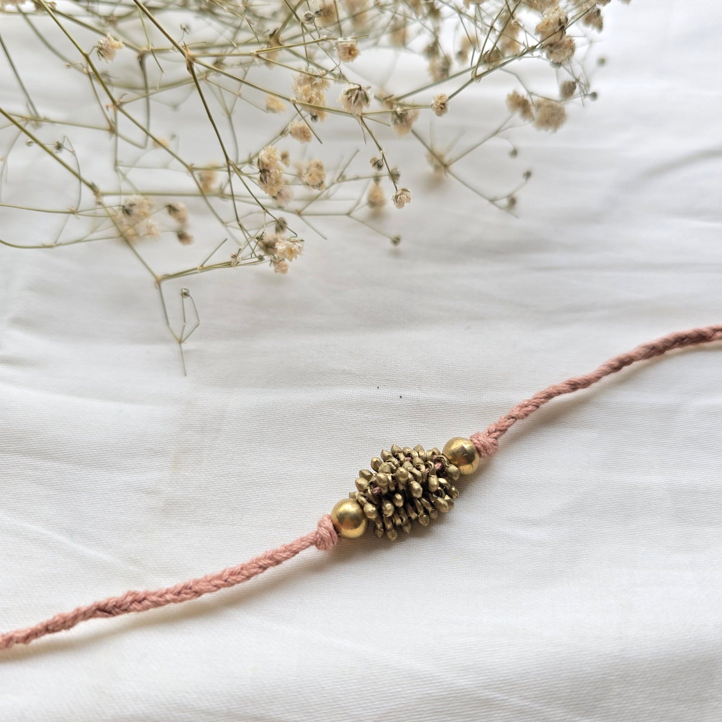 Zarna Brass Beads Rakhi - English colors