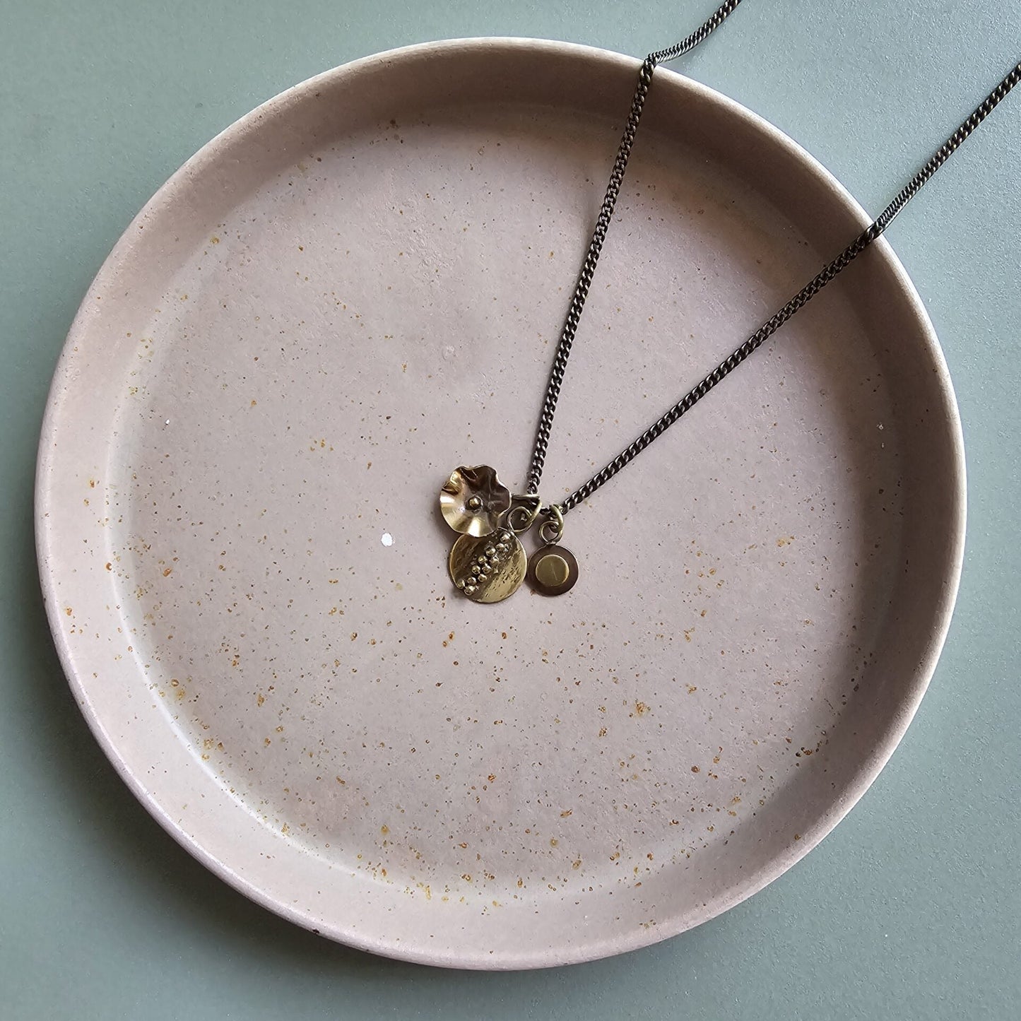 Button, oval and flower pendants