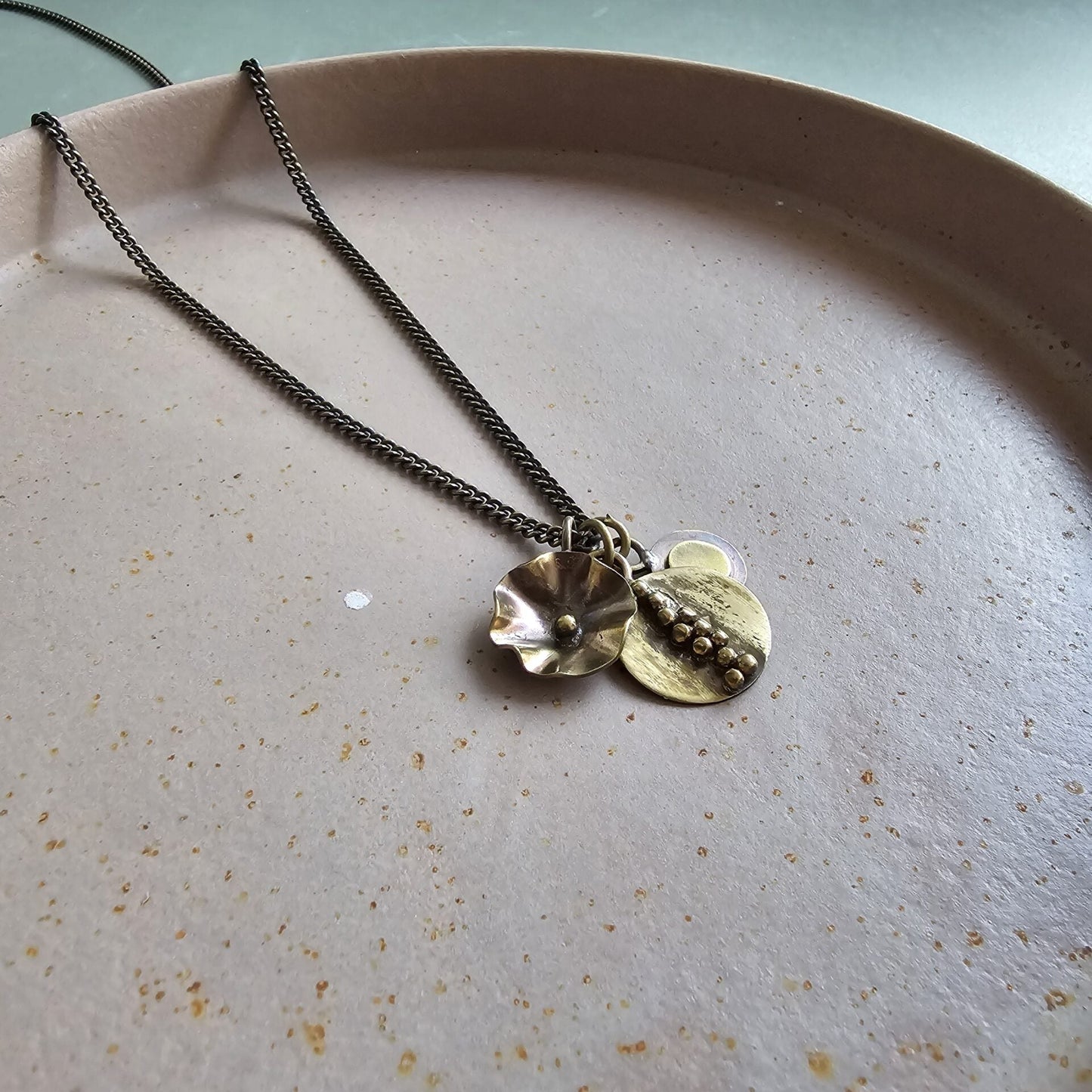 Button, oval and flower pendants