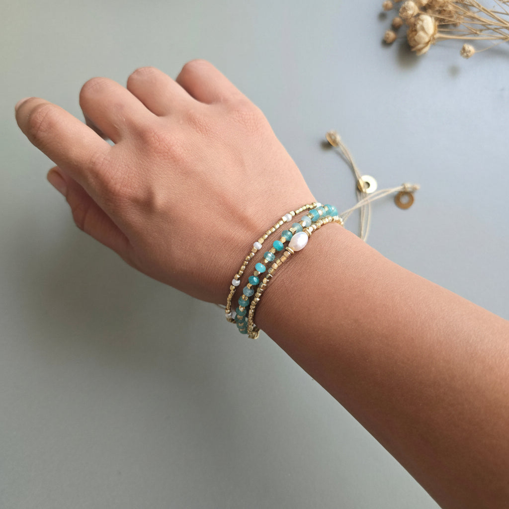 Aqua blue Onyx Lumba Bracelet with Brass Charms
