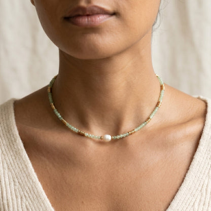 Necklace worn by a person with a neutral background