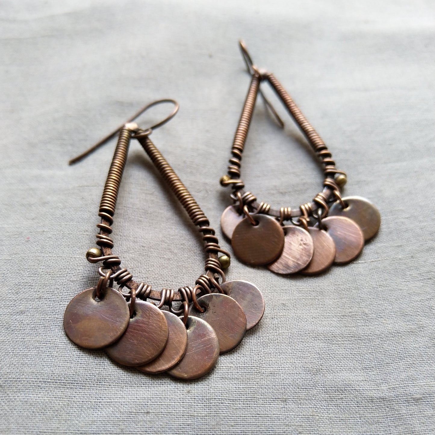 Drop shaped circular disc earrings