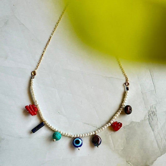 pearl choker with evil eye