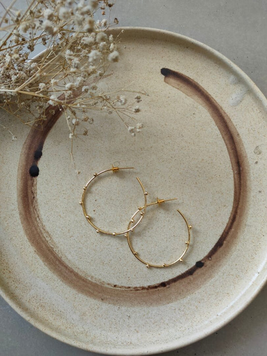 Hammered hoops with ball accents