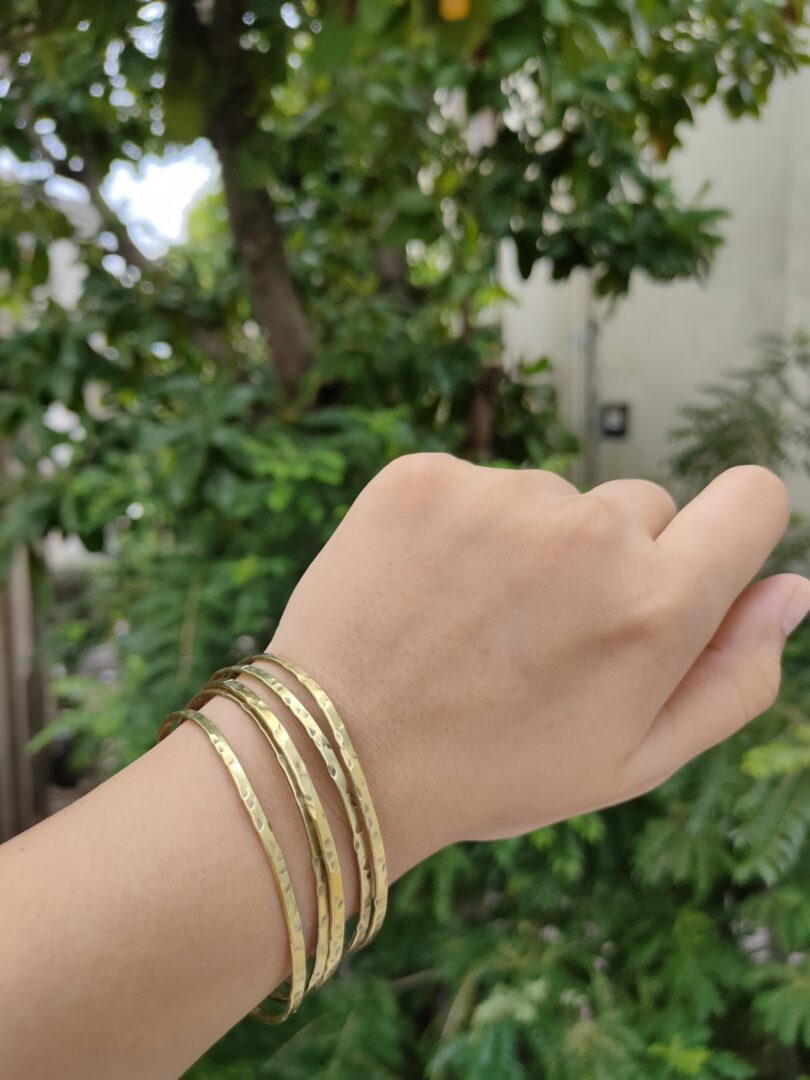 Stacked brass bangles