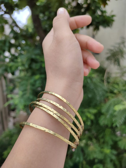 Stacked brass bangles