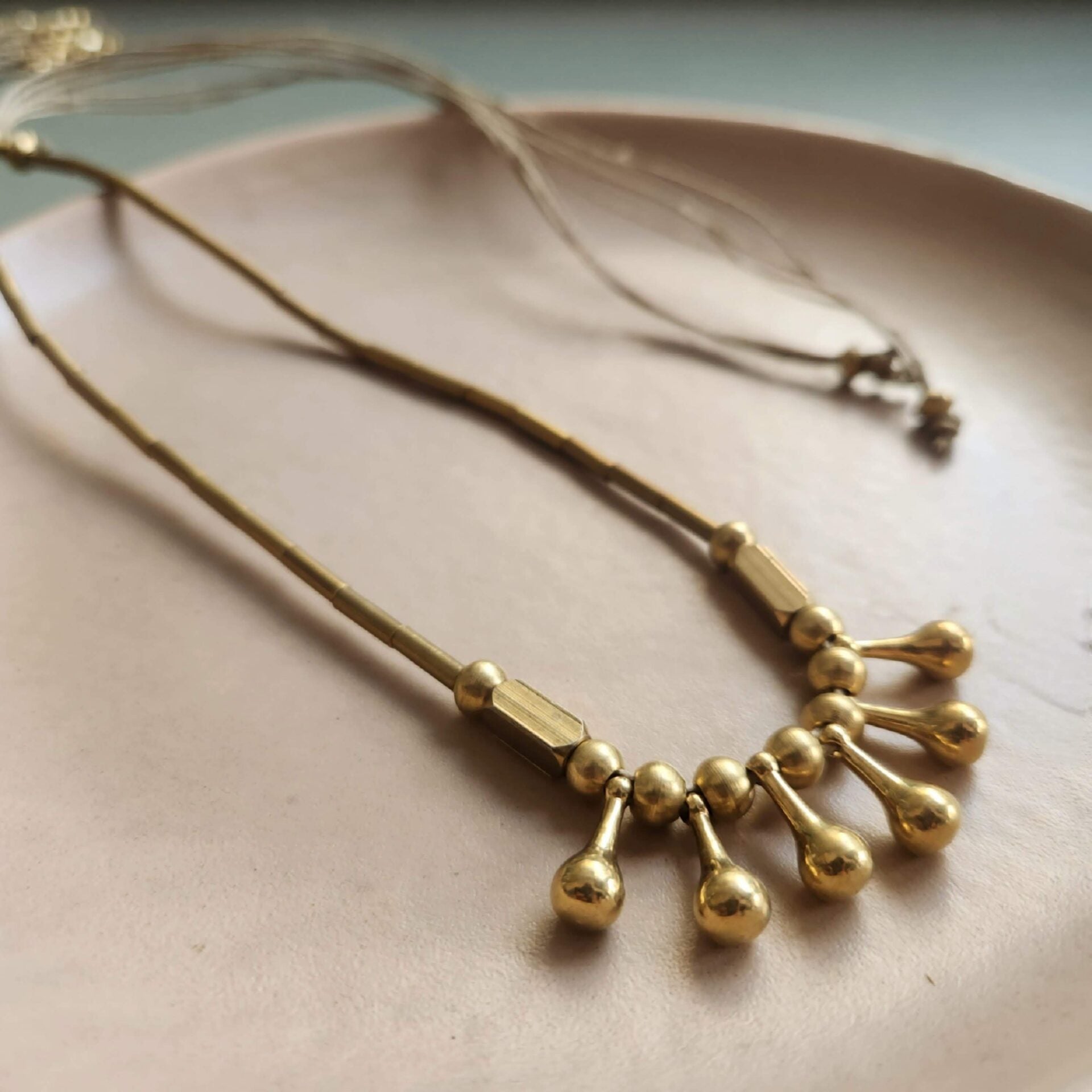 Marigold Brass Necklace handmade jewelry, closeup view