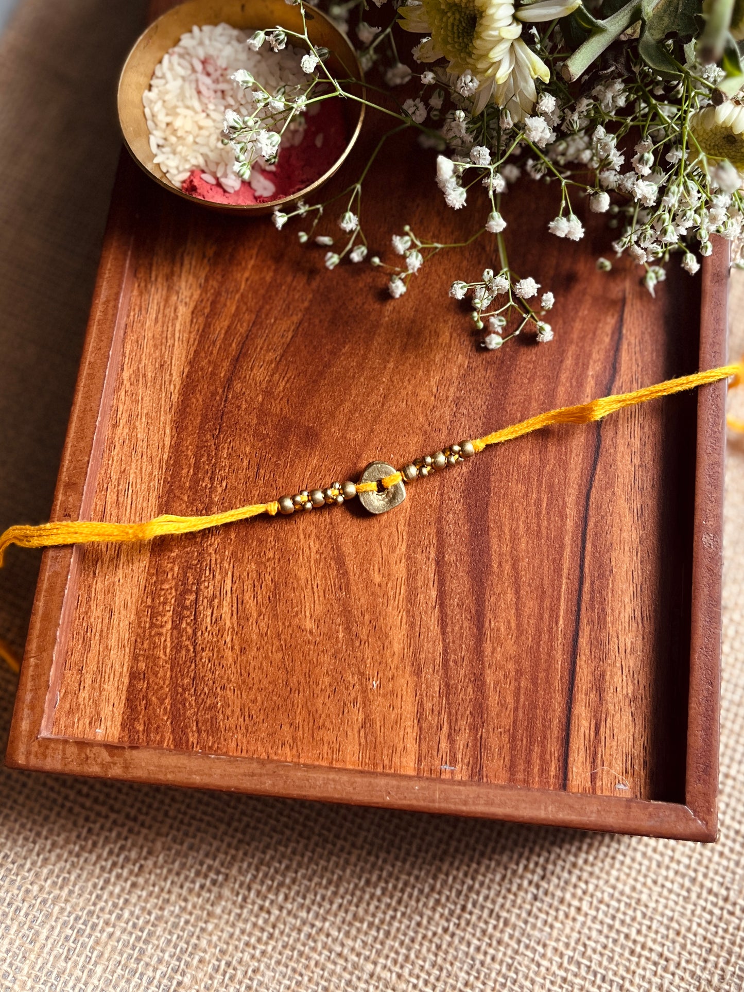 The Organic Brass Charm Rakhi