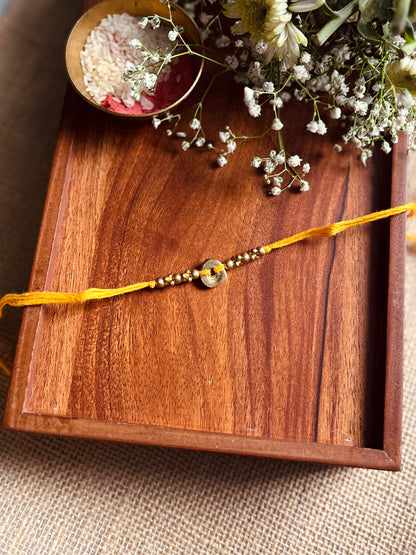 The Organic Brass Charm Rakhi