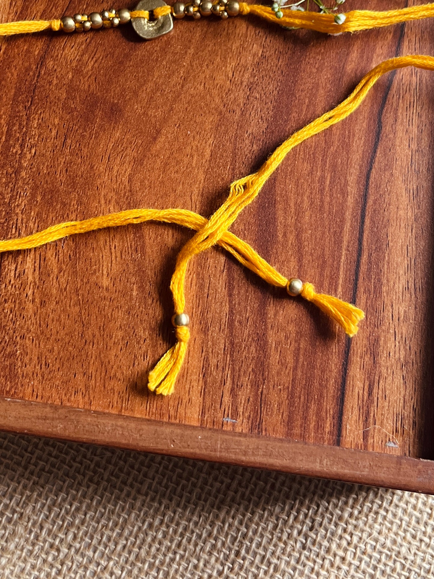 The Organic Brass Charm Rakhi