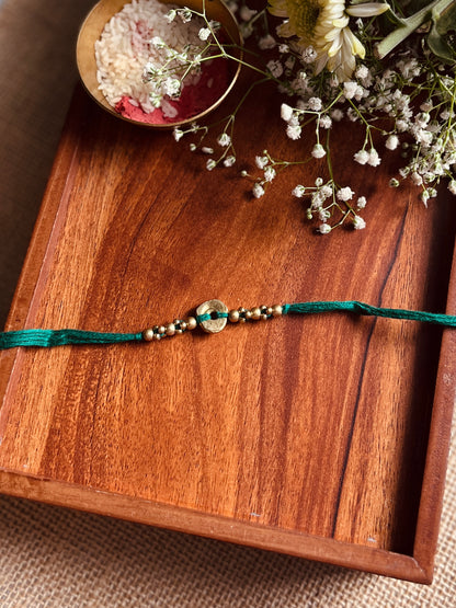 The Organic Brass Charm Rakhi