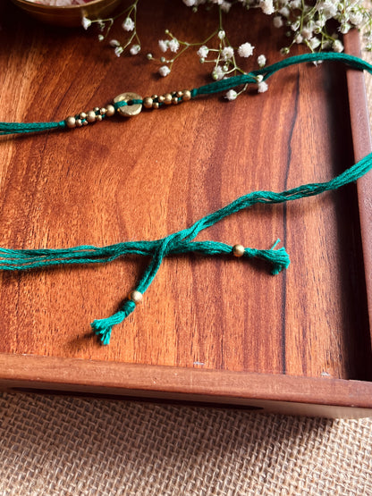 The Organic Brass Charm Rakhi