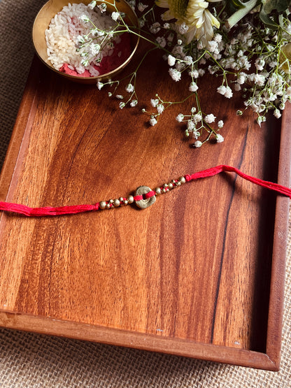 The Organic Brass Charm Rakhi