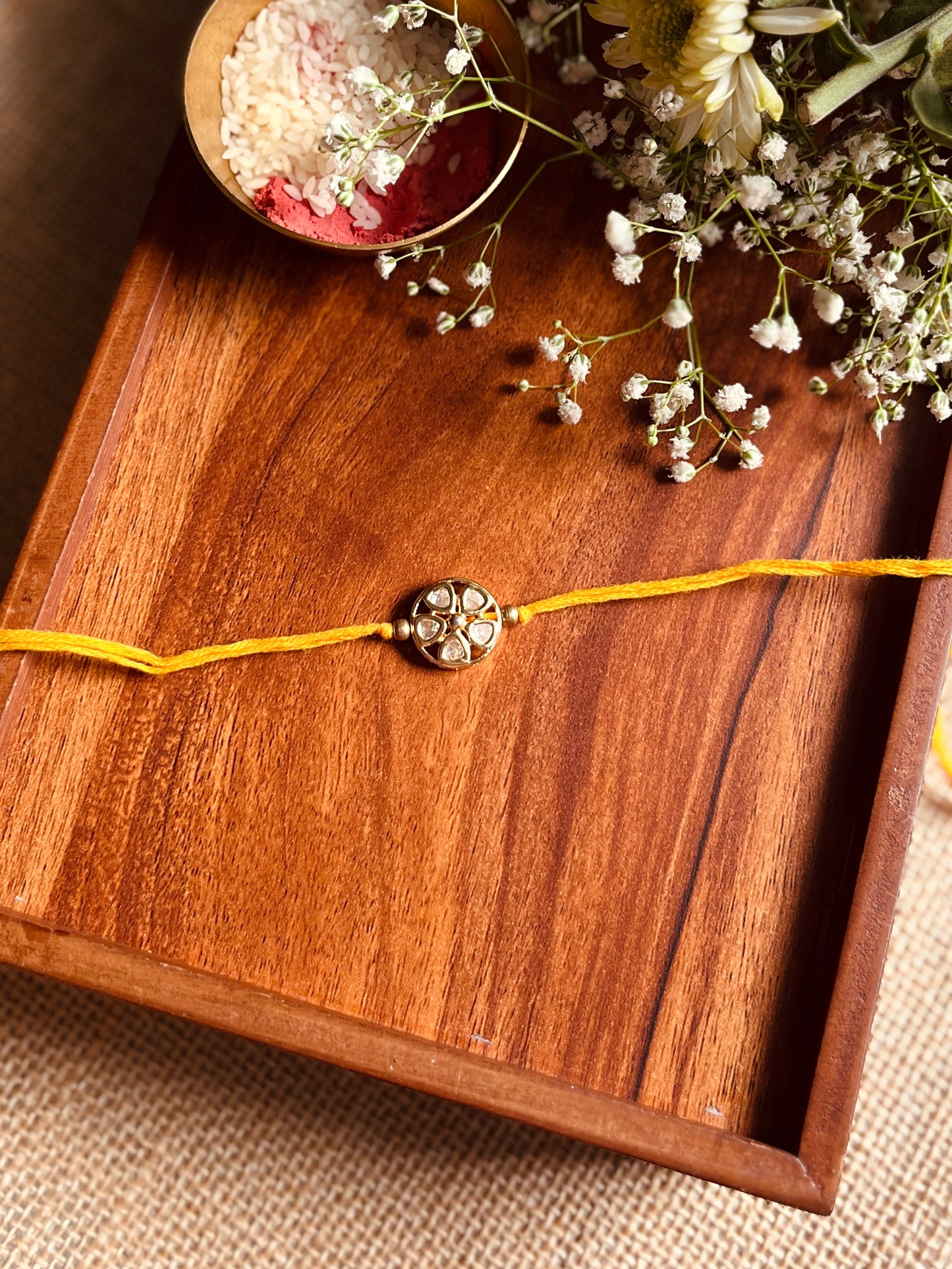 Floral Kundan Brass Rakhi