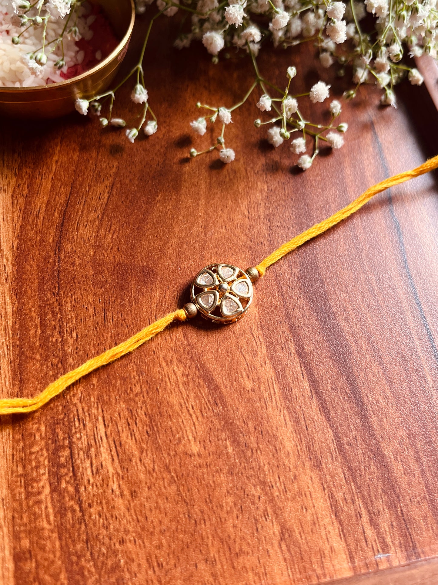 Floral Kundan Brass Rakhi
