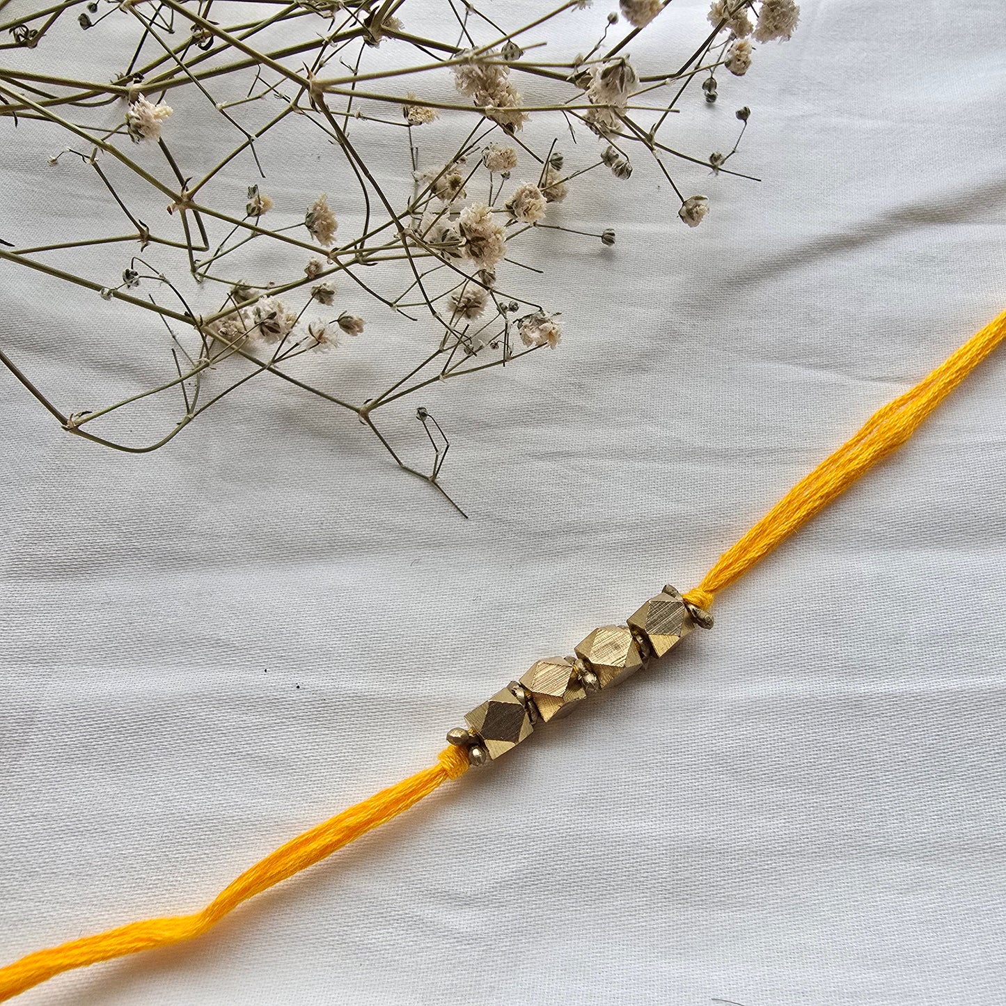 4 Beads Brass rakhi - english colors
