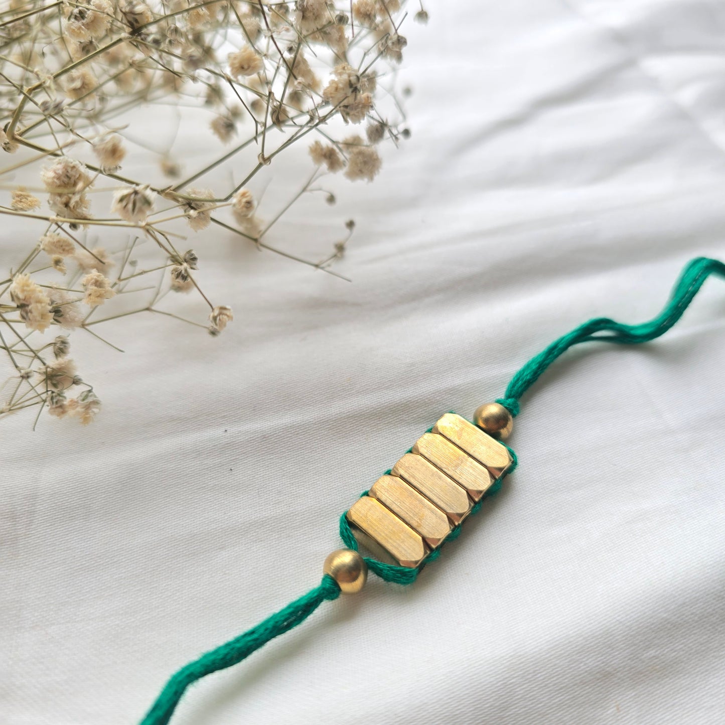 Rectangle Brass Beads Rakhi - english color