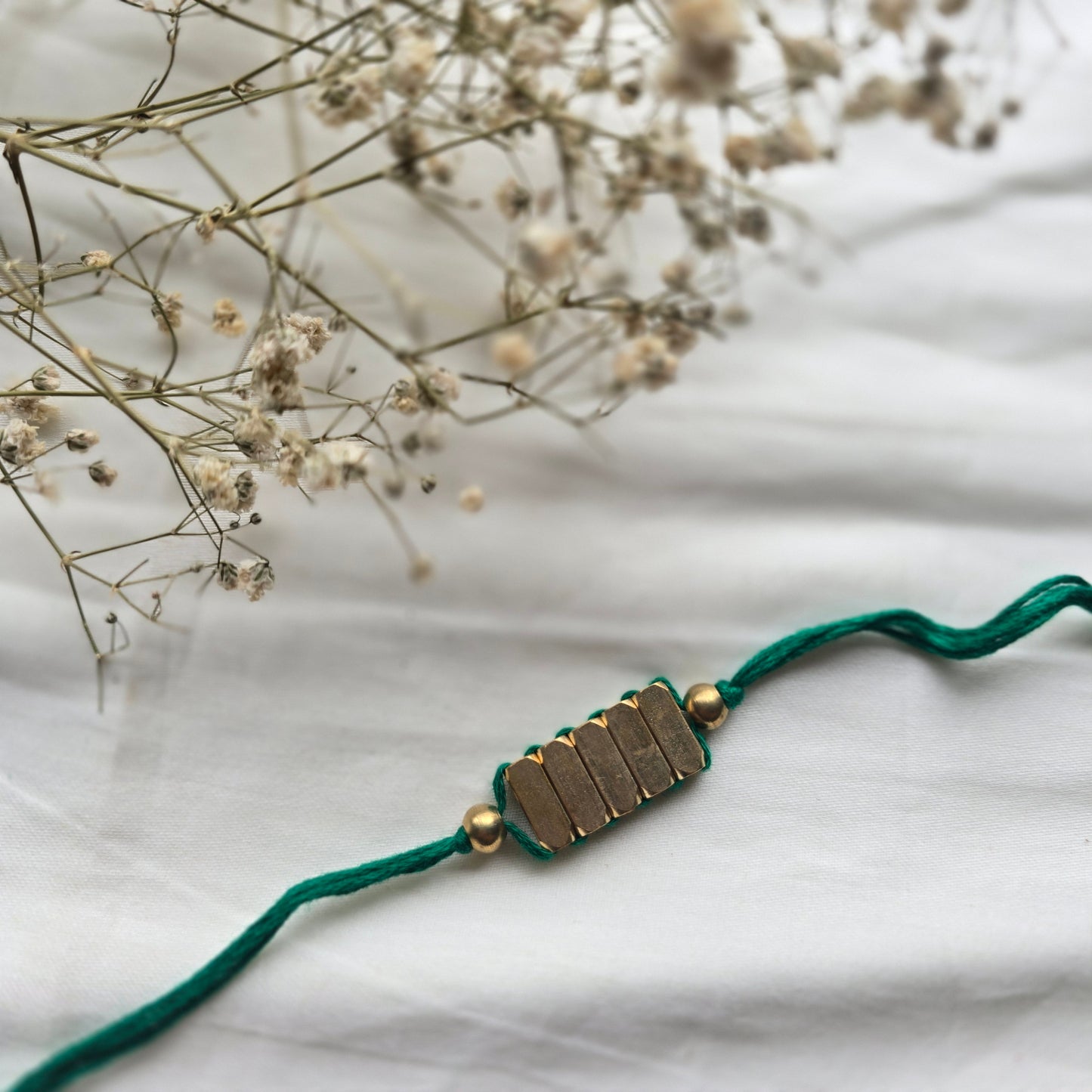 Rectangle Brass Beads Rakhi - english color
