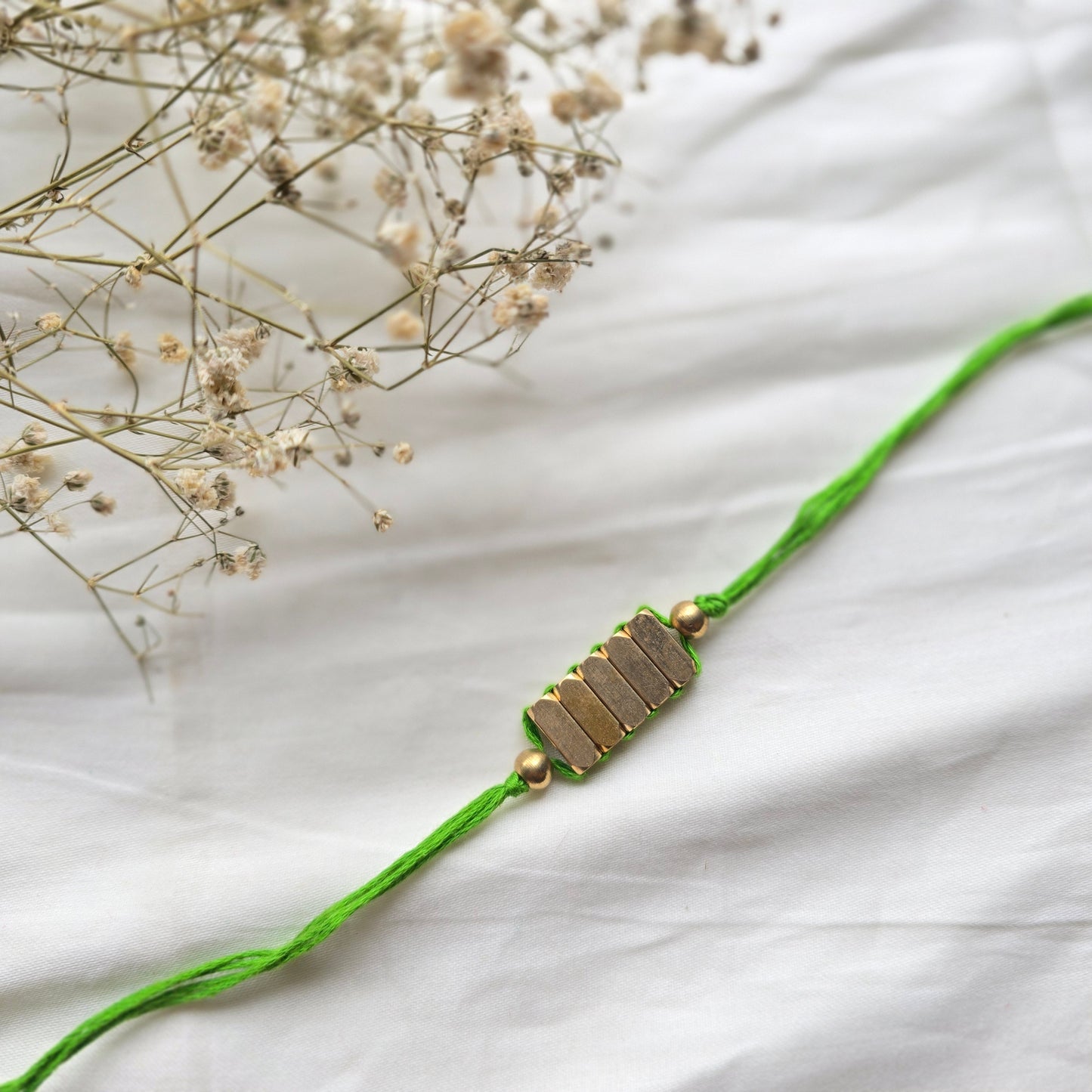 Rectangle Brass Beads Rakhi - english color