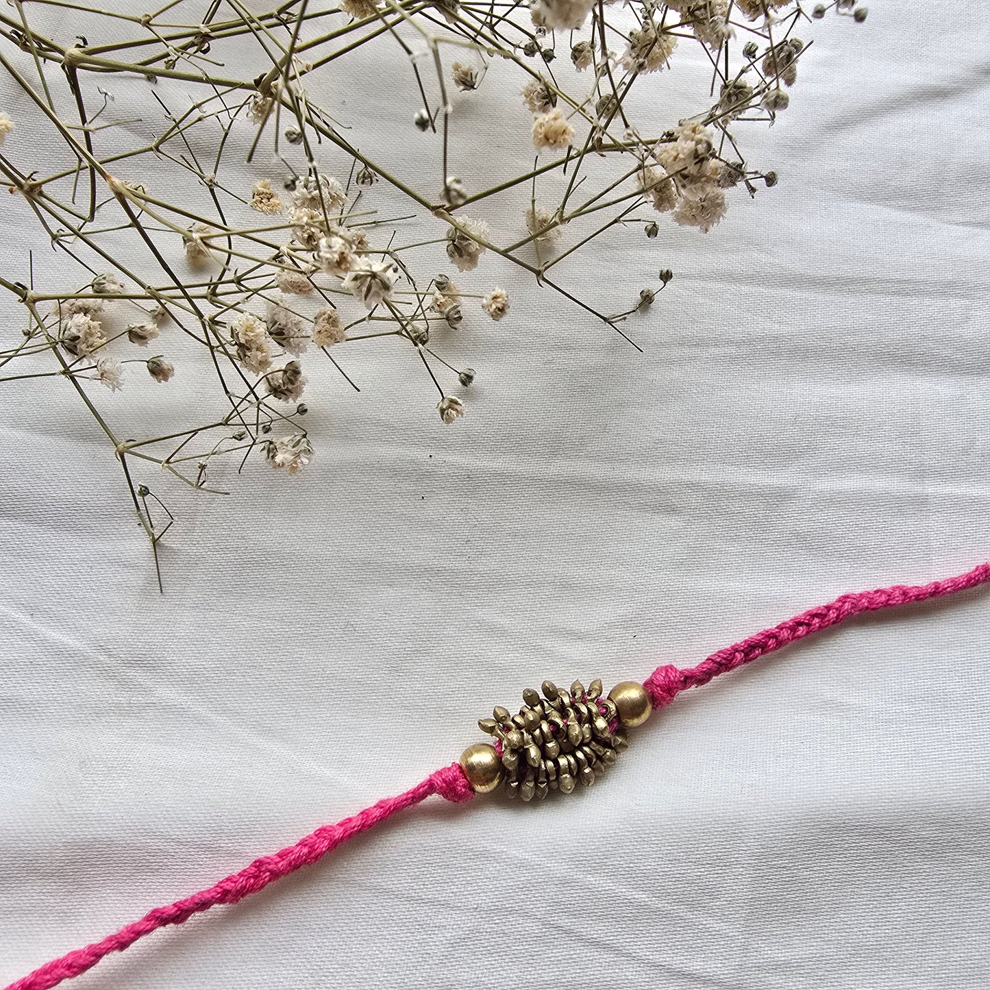 Zarna Brass Beads Rakhi - English colors