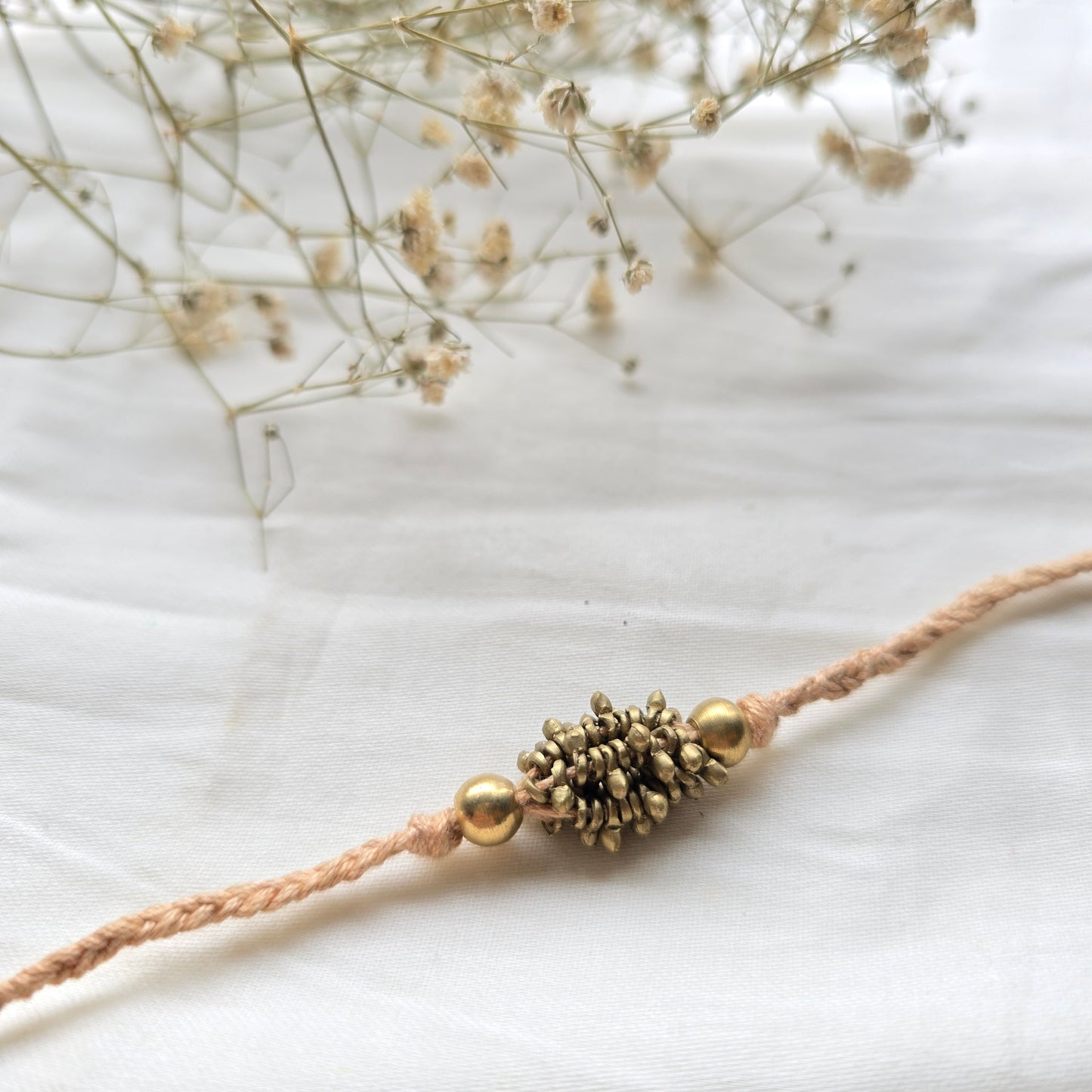 Zarna Brass Beads Rakhi - English colors