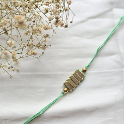 Rectangle Brass Beads Rakhi - english color