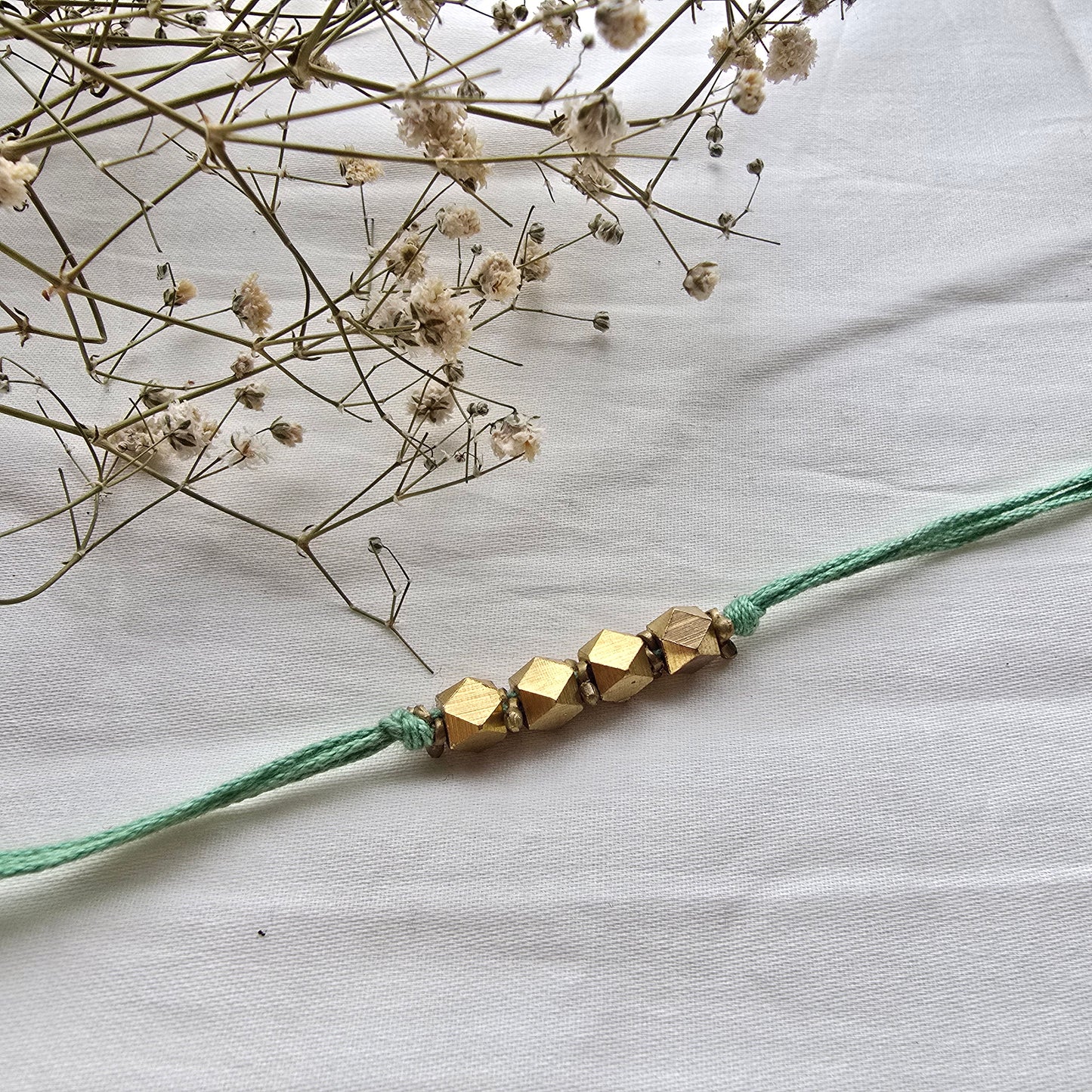 4 Beads Brass rakhi - english colors