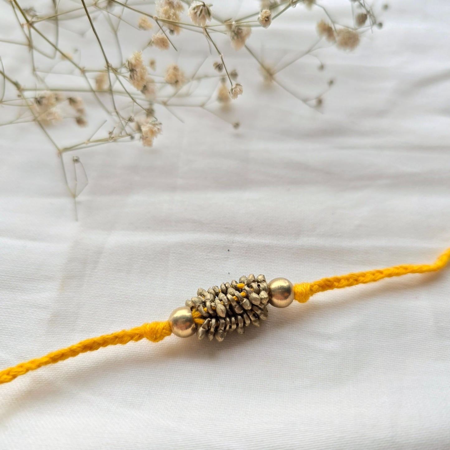 Zarna Brass Beads Rakhi - English colors