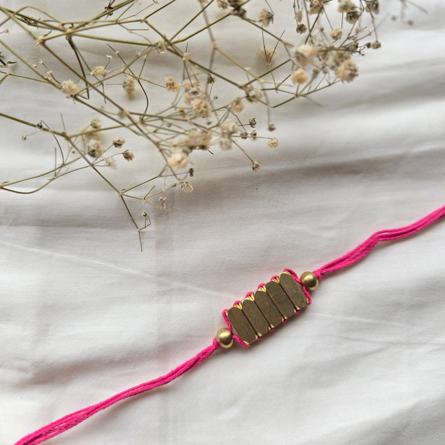 Rectangle Brass Beads Rakhi - english color